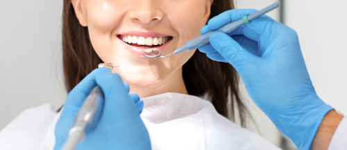 woman smiling while visiting the dentist